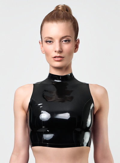 Model wearing the SIN Latex Top in black with slim standing collar and triangle cut-out in the back. Handcrafted in Berlin.